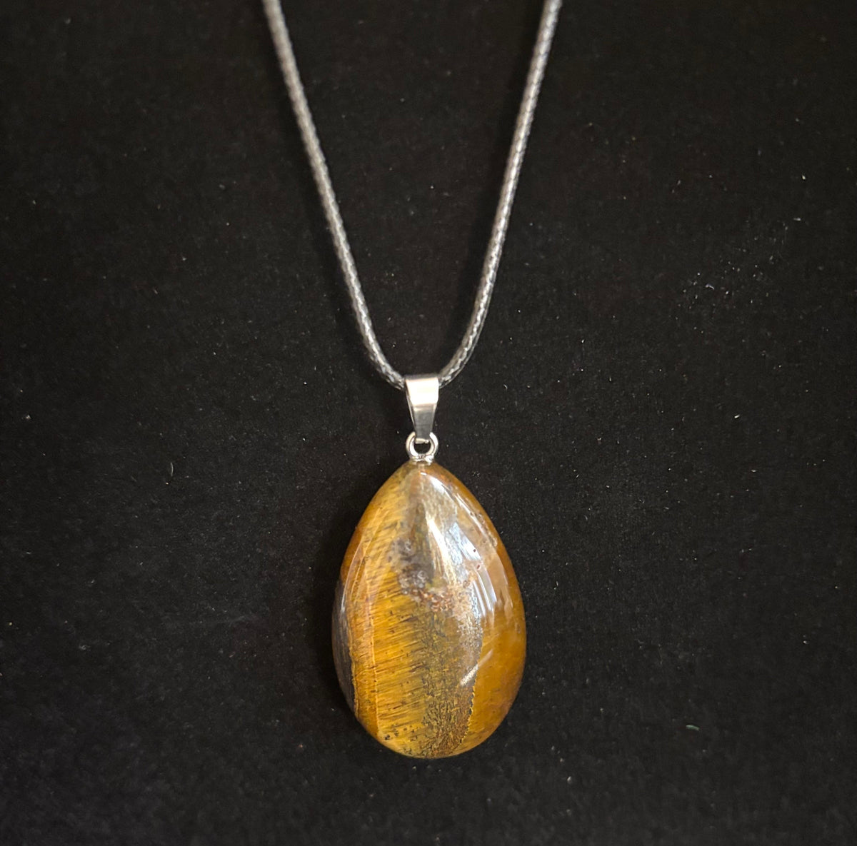 Grounded Elegance: Natural Tiger Eye Leather Pendant Necklace on Leather Rope